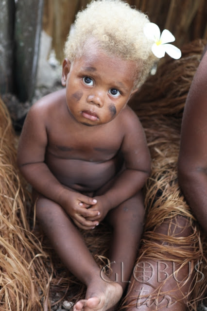 Black people with natural blonde hair - Melanesian population -  
