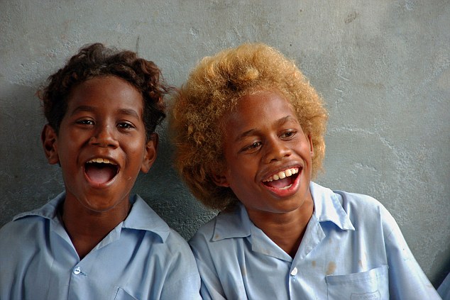 SOLOMON ISLANDS. Melanesian boyfriends wearing light blue shirts