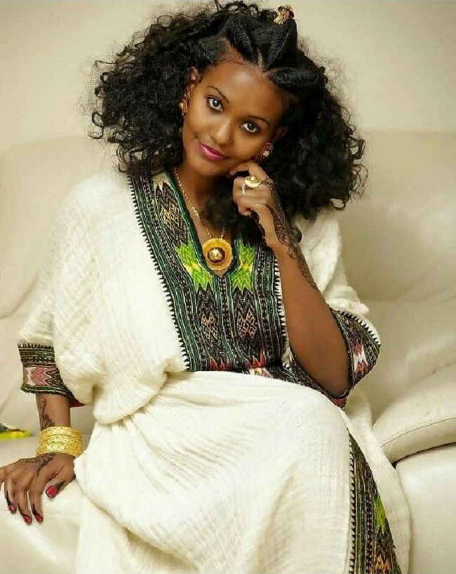 Elegant Ethiopian women in habesha kemis dress.